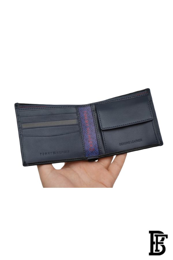 Tommy Hilfiger Wallet is a one to face solid style covered in light/black leather - Image 7