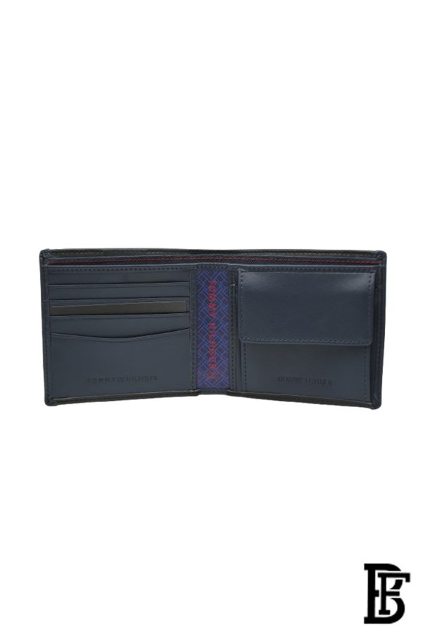 Tommy Hilfiger Wallet is a one to face solid style covered in light/black leather - Image 9